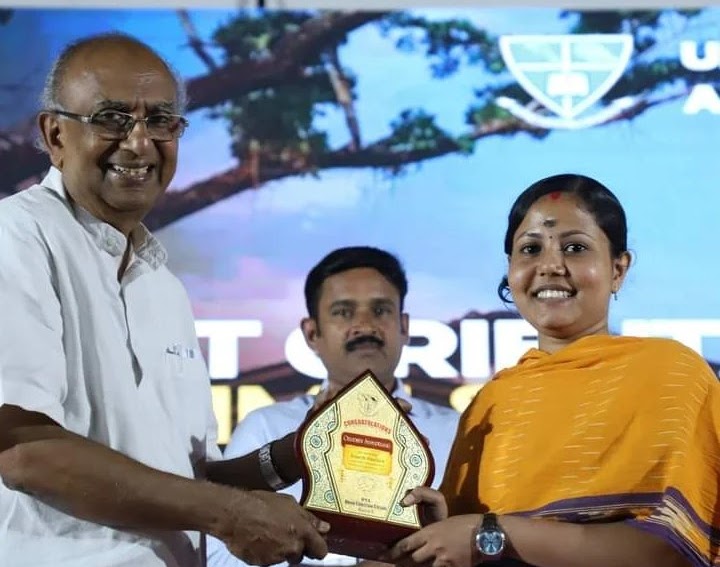 Chandhini Syamaprasad receiving memento   for  securing  fourth rank in MG University